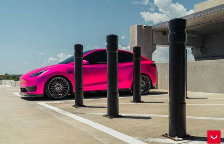 A telsa model y hybrid pink car
