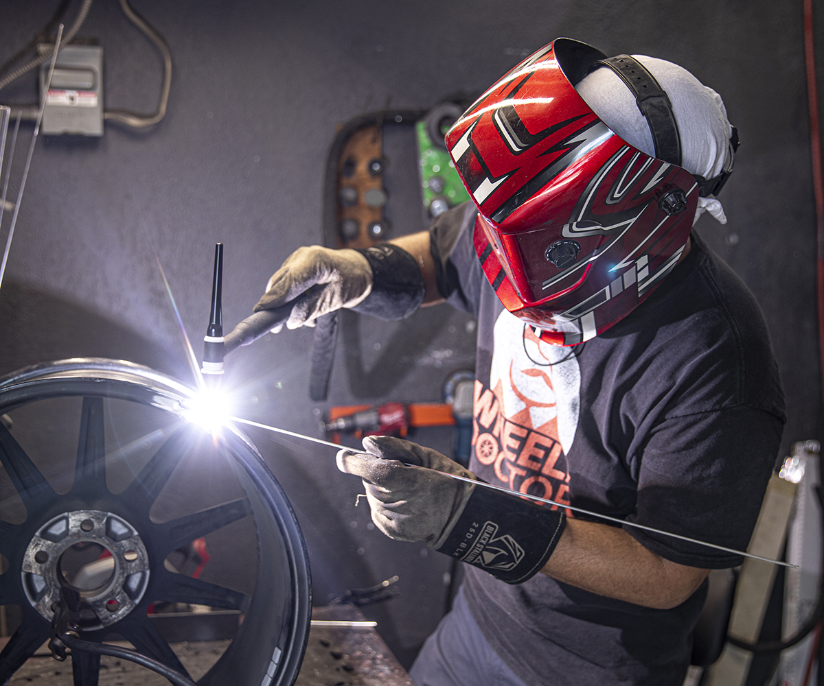 Wheels Doctor technicians repairing damaged rims